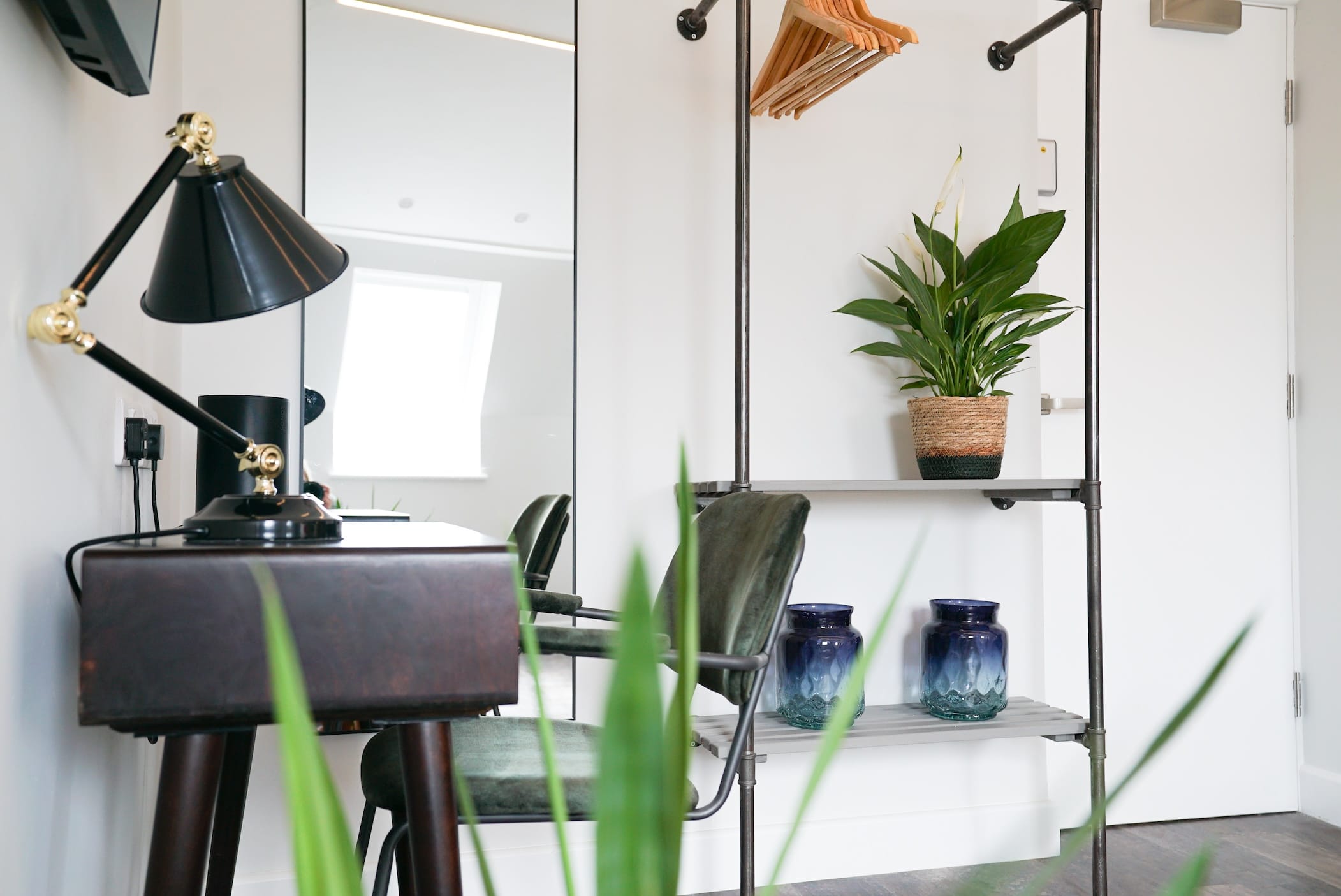 Sgwar Eryri Super King Room desk chair, plants and clothes hanger